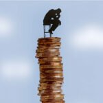 Indian market divergence chart showing rising Nifty index versus falling small-cap investor portfolios in 2025